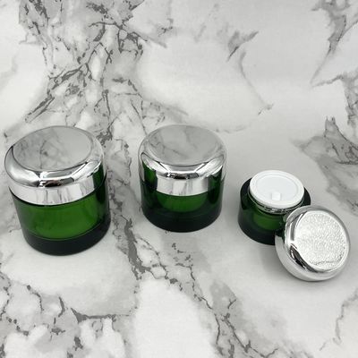 L'emballage cosmétique écologique vert 50g 100g a métallisé des pots pour des produits de soin pour la peau