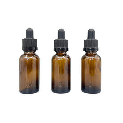 Le cosmétique 30ml en verre ambre met l'huile en bouteille essentielle avec le compte-gouttes de fermeture de rochet