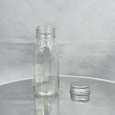 Renversez non la bouteille cosmétique en verre de l'emballage 60ml de soins de la peau avec le chapeau en aluminium